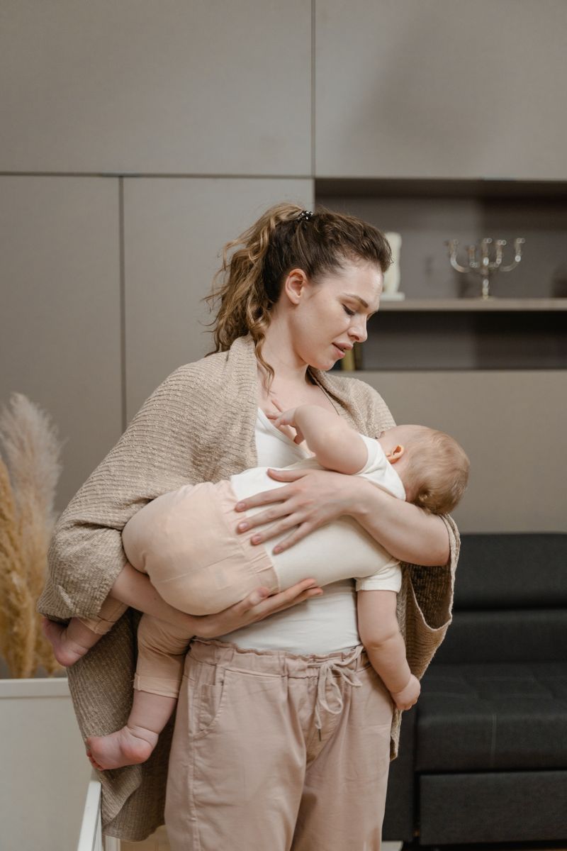 A mother cradling her newborn